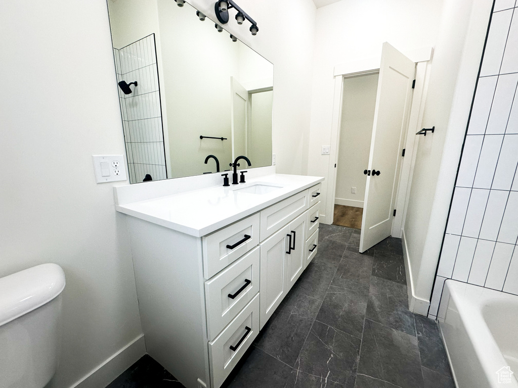 Bathroom with vanity and toilet