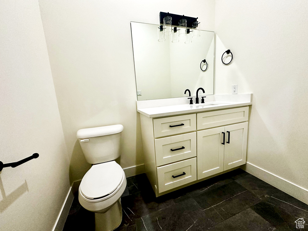 Bathroom with vanity and toilet