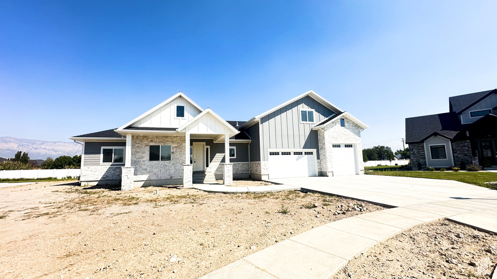 View of front facade featuring a garage