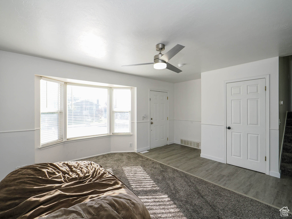 Interior space featuring ceiling fan and wood-type flooring