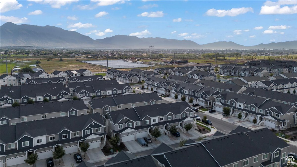 Birds eye view of property with a mountain view