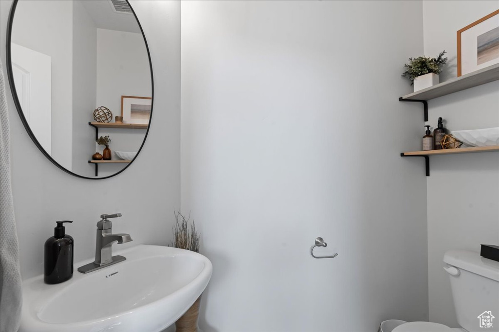 Bathroom featuring toilet and sink