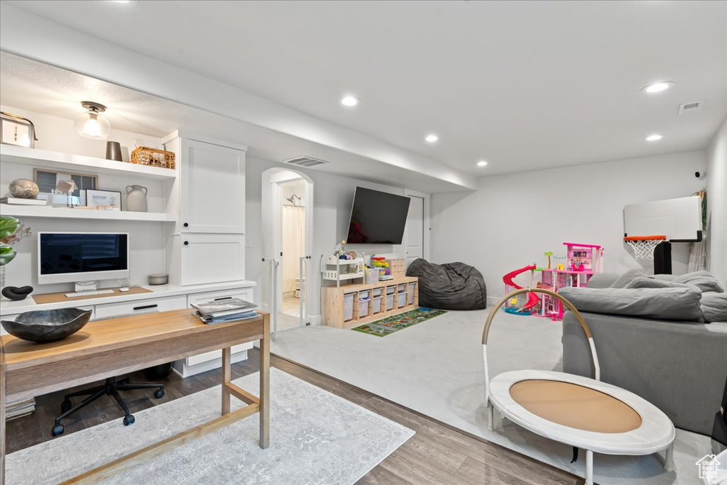 Living room with hardwood / wood-style flooring