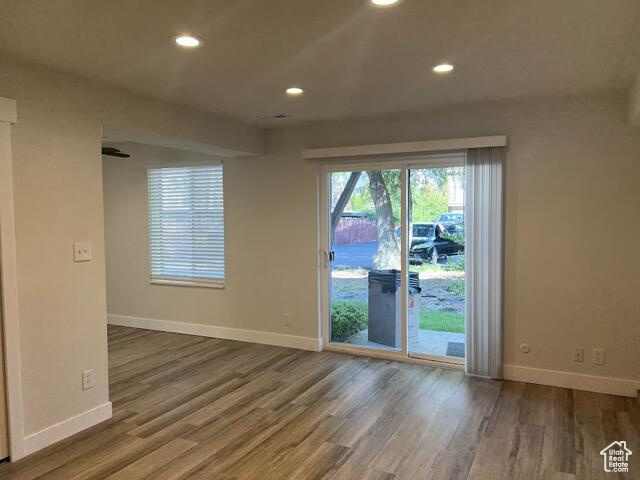 Doorway to outside featuring dark wood-type flooring