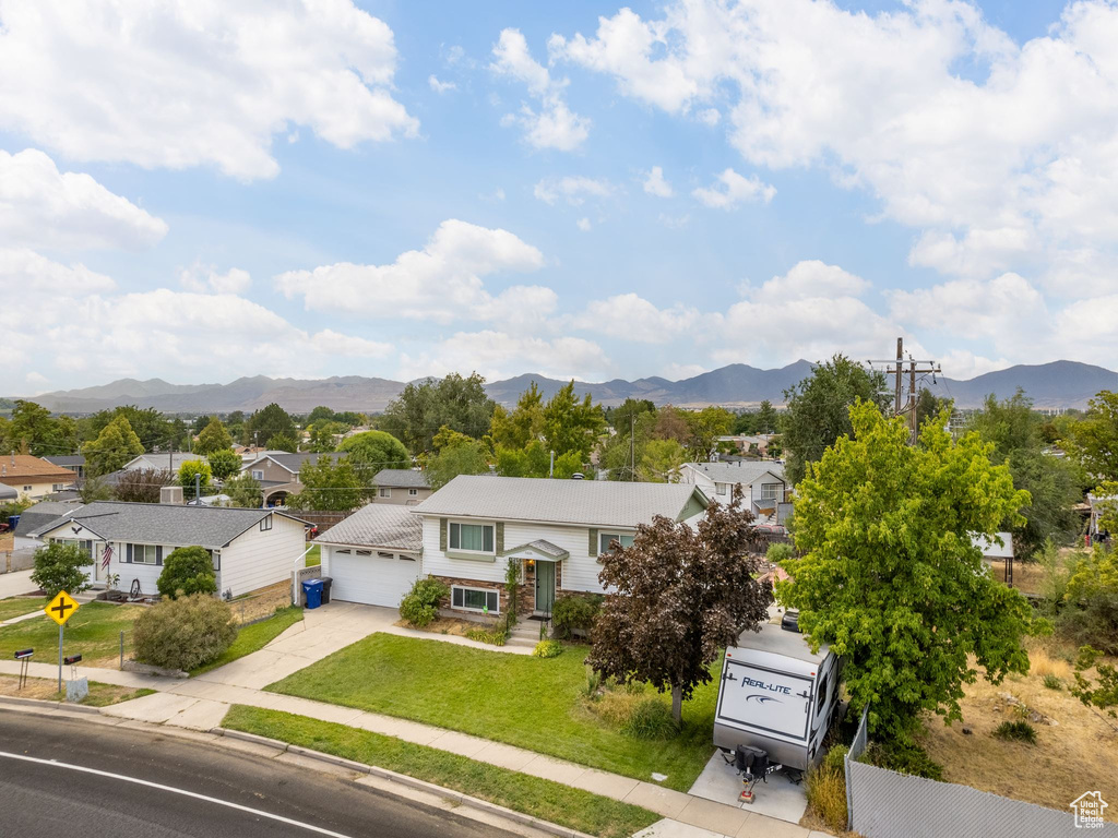 Birds eye view of property with a mountain view