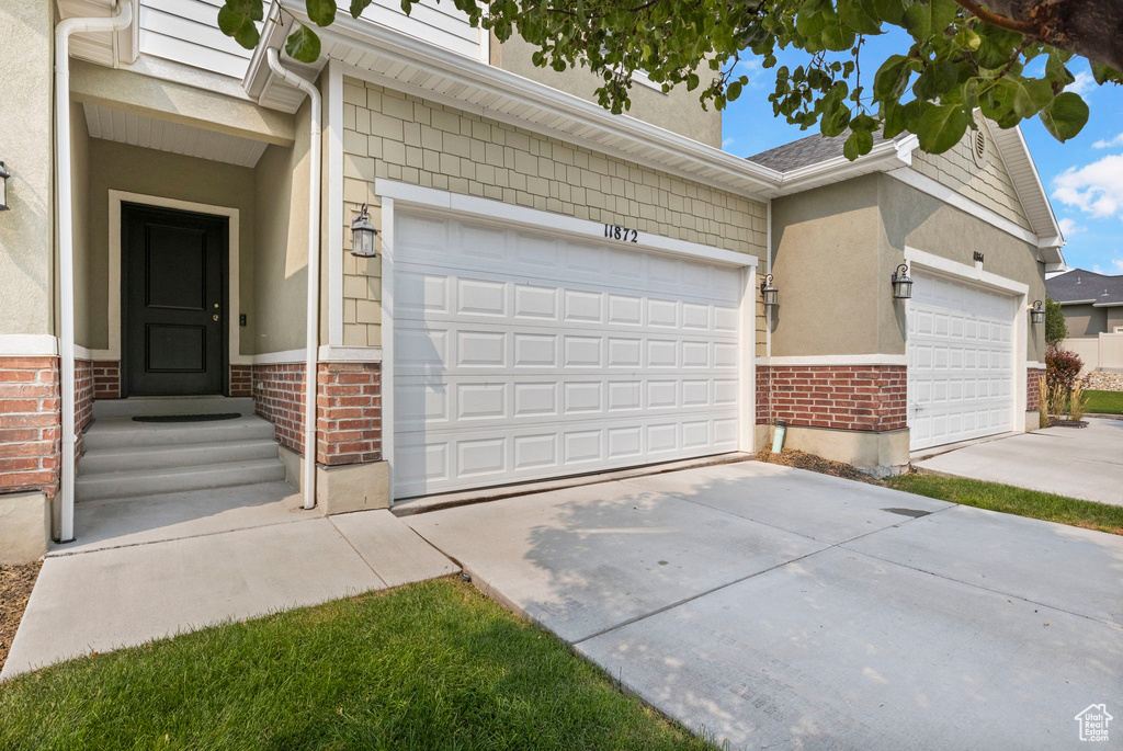 View of front of property featuring a garage