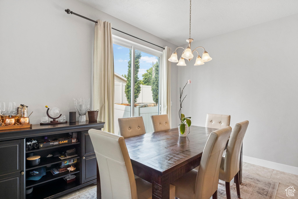 Dining area with a chandelier