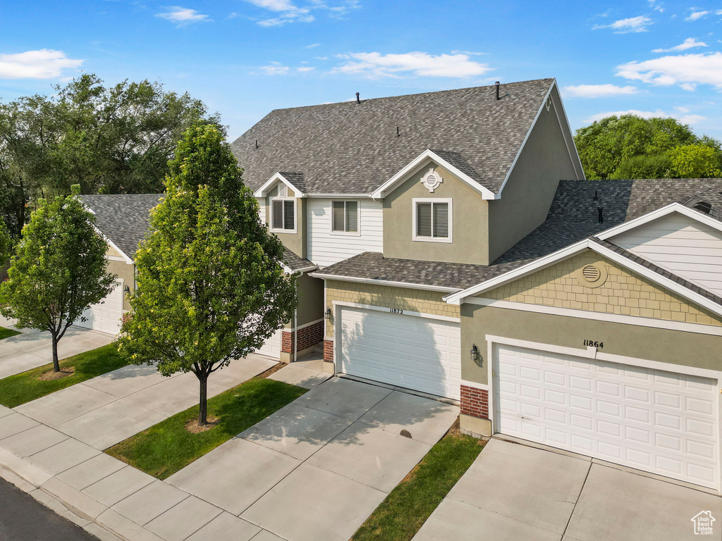 View of front of property featuring a garage