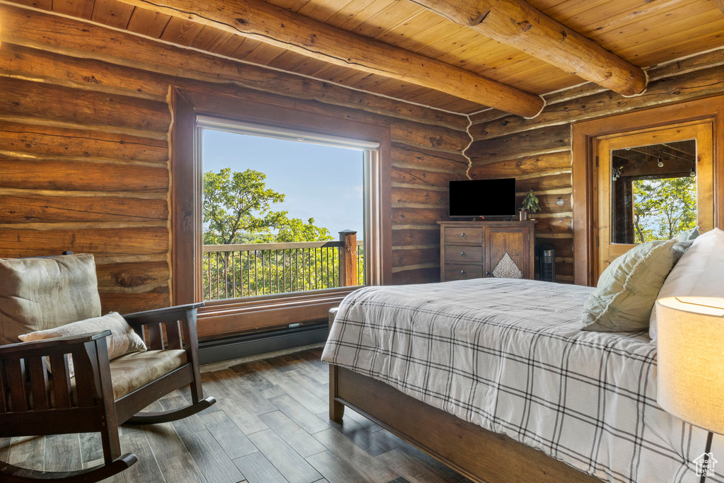 Bedroom featuring wood ceiling, dark hardwood / wood-style floors, beamed ceiling, and multiple windows