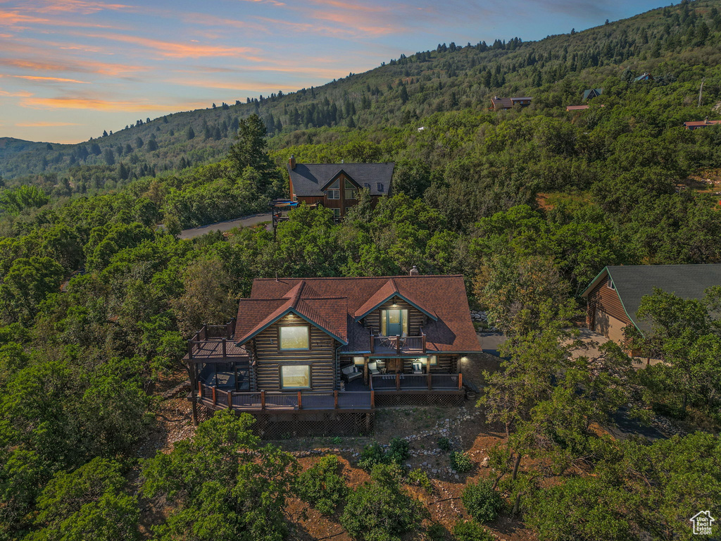 Aerial view at dusk featuring a mountain view