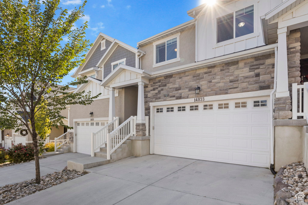 View of front of property with a garage