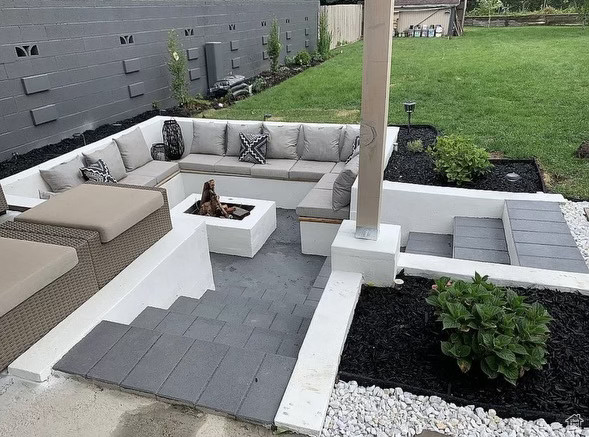 View of patio / terrace featuring an outdoor living space with a fire pit