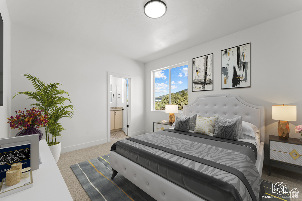 Bedroom featuring carpet and ensuite bathroom