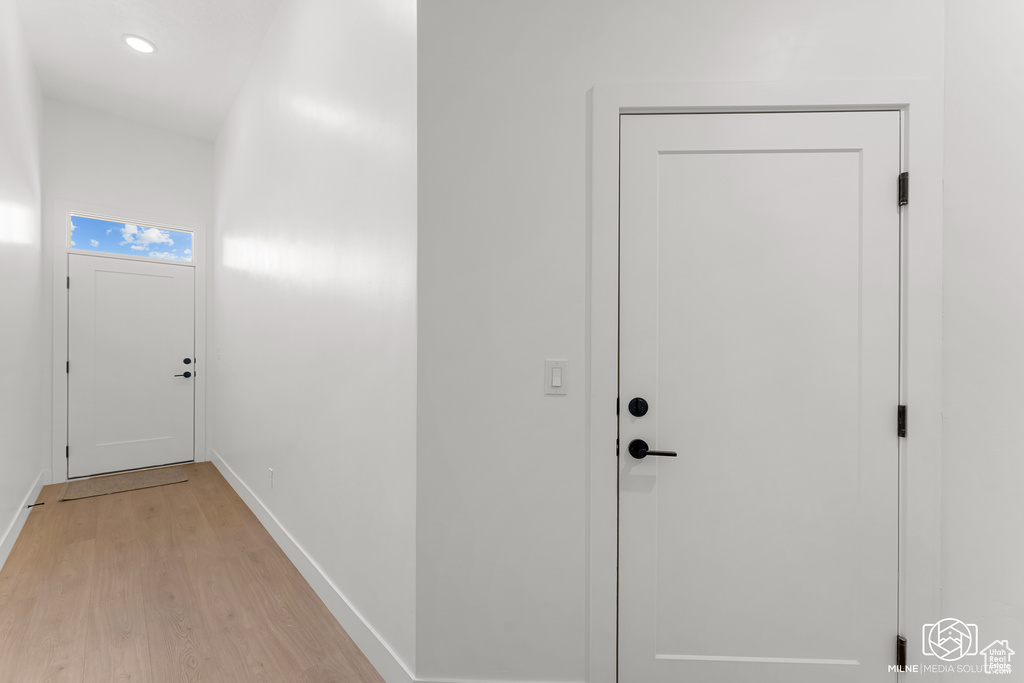 Doorway with light wood-type flooring