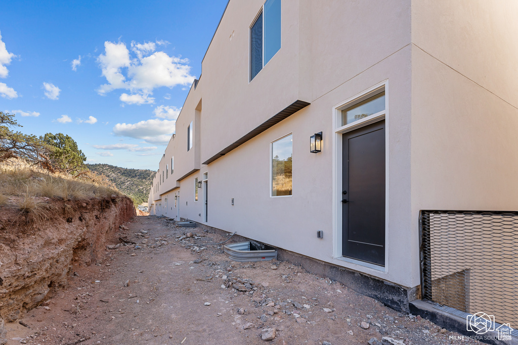 View of property exterior featuring a mountain view