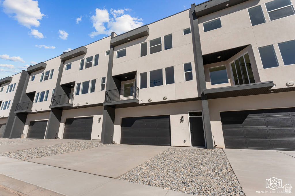 View of building exterior featuring a garage