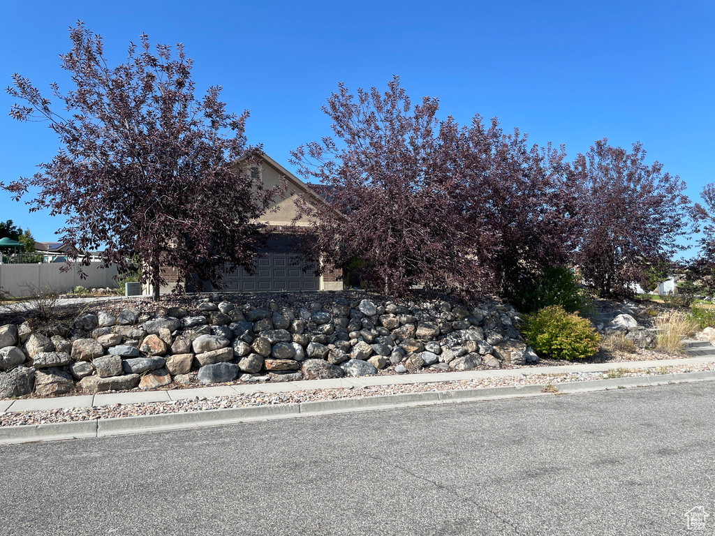 Obstructed view of property with a garage