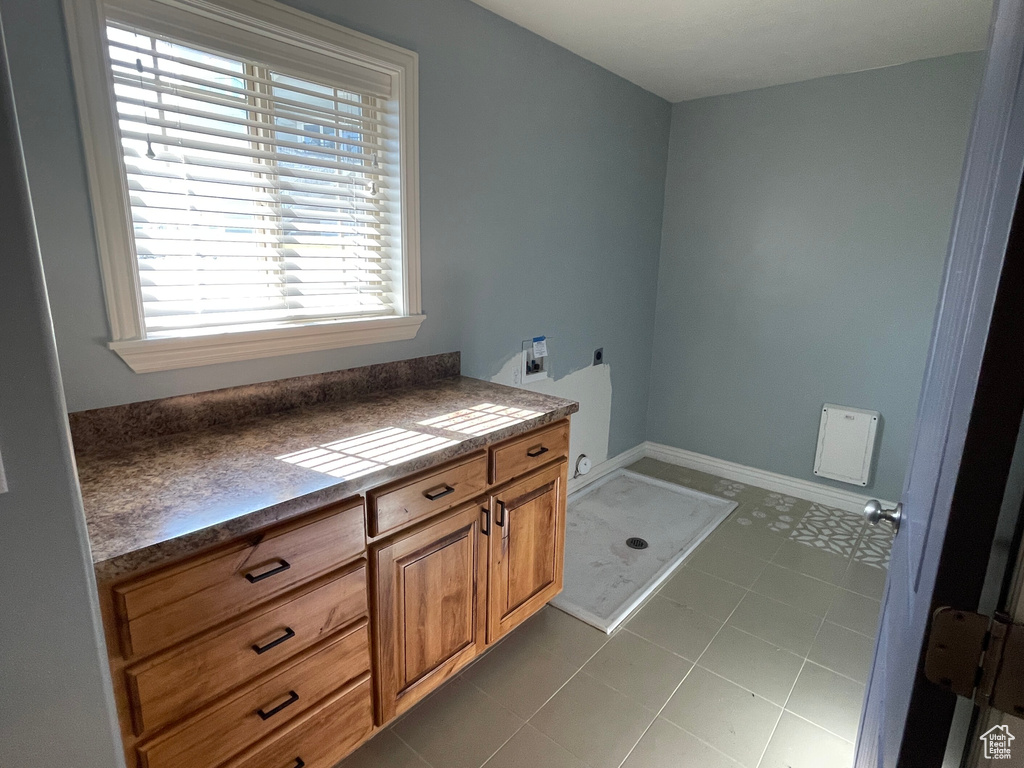 Bathroom featuring vanity and tile patterned floors