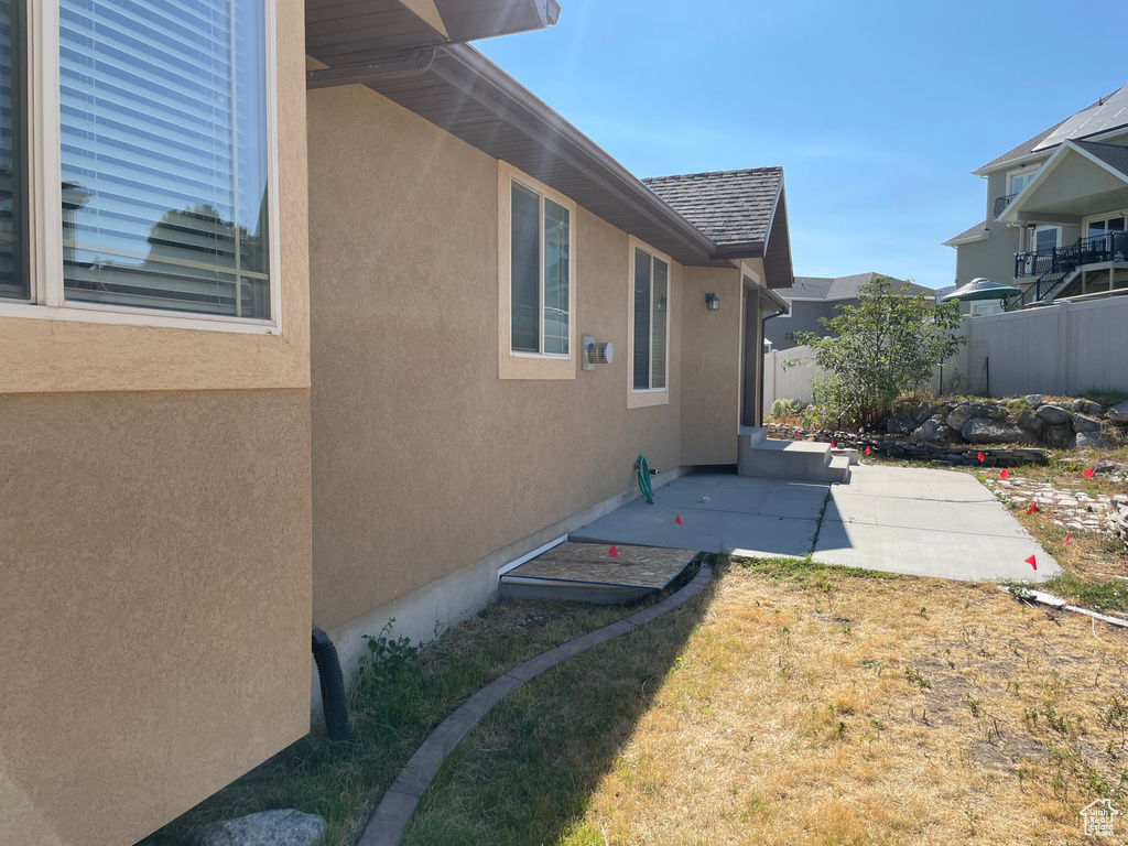 Exterior space with a yard and a patio area