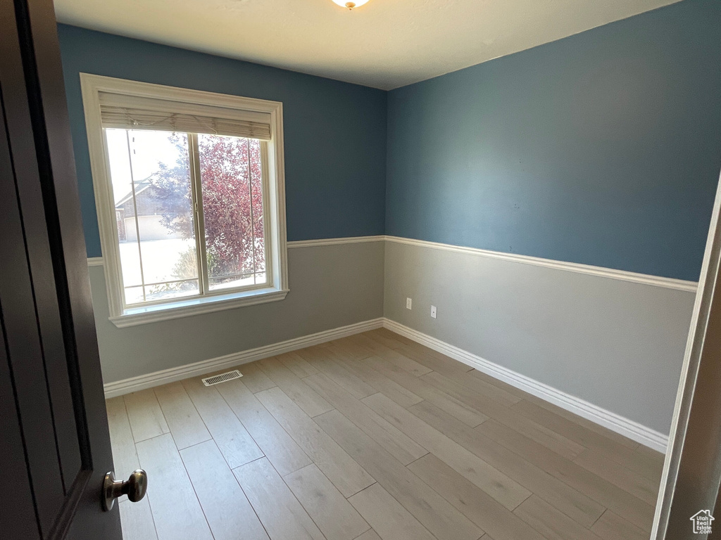 Spare room with light hardwood / wood-style flooring