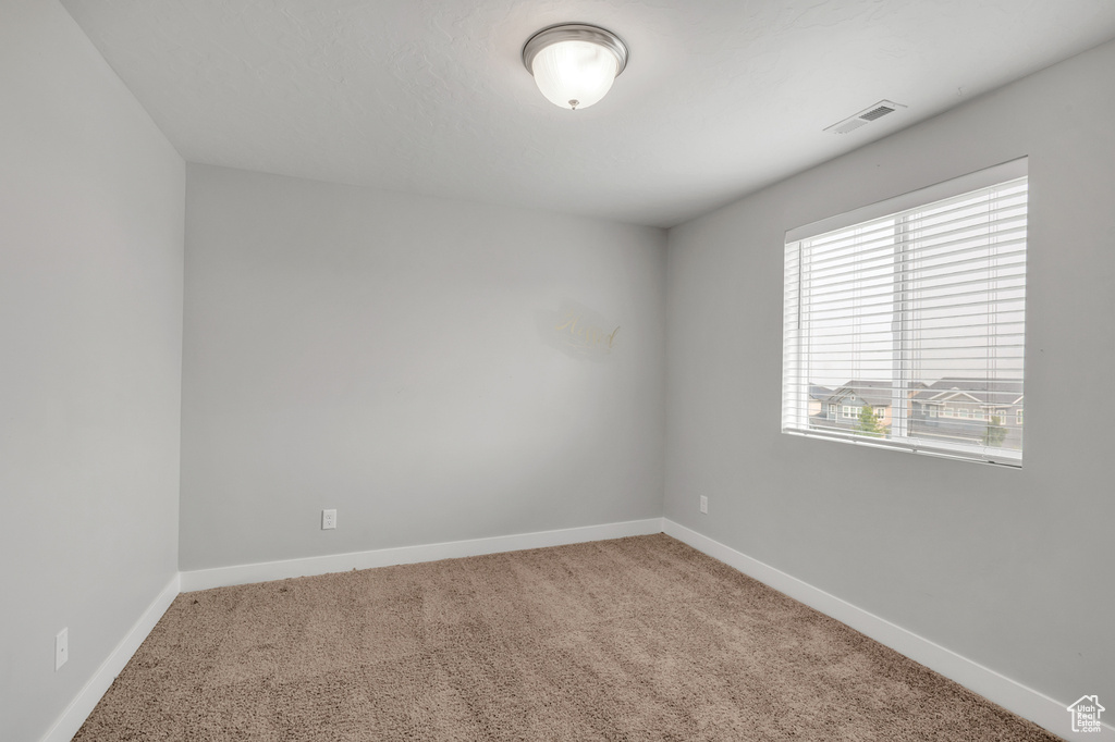 View of carpeted spare room