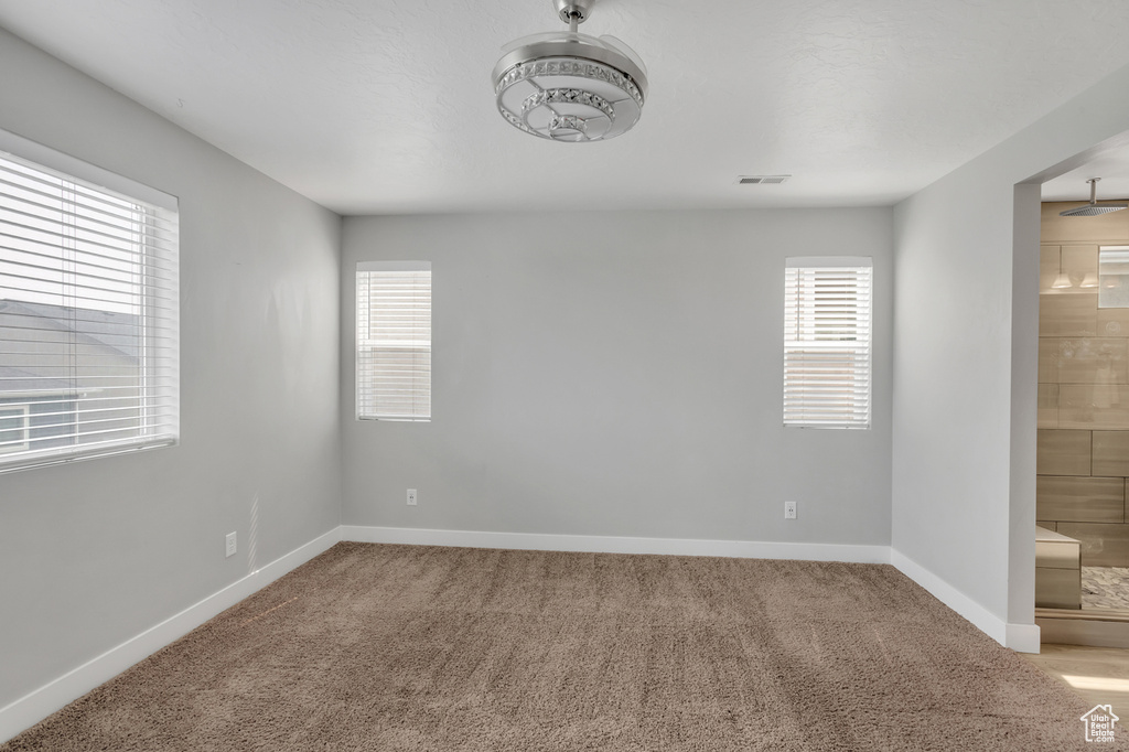 View of carpeted spare room