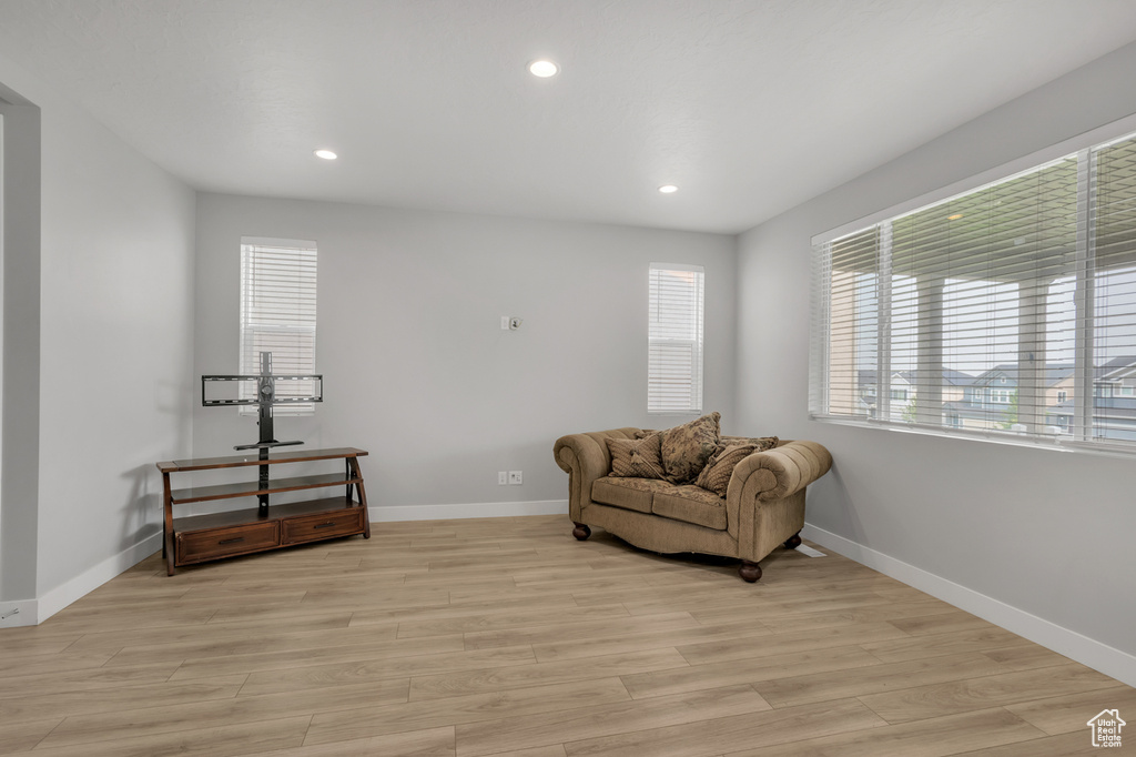 Living area with light hardwood / wood-style floors