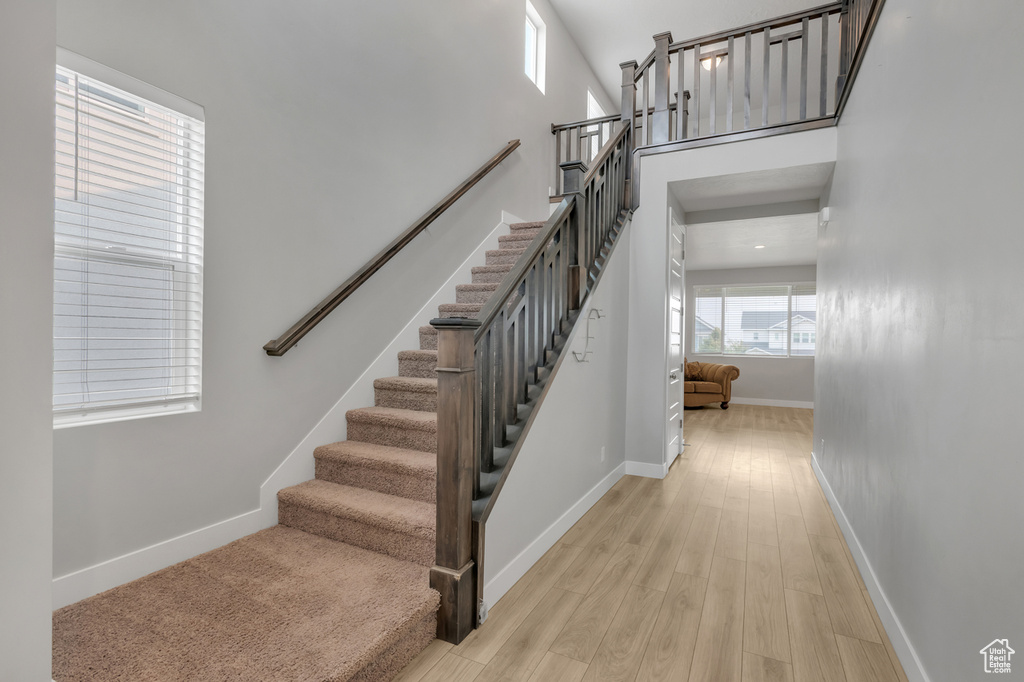 Stairway with hardwood / wood-style floors