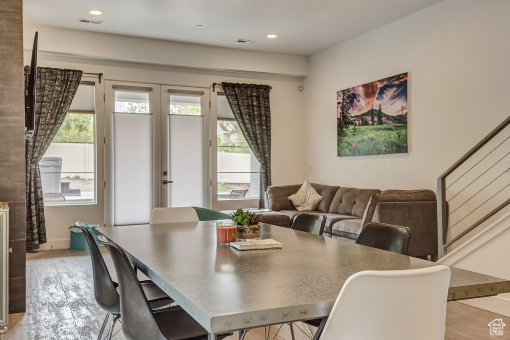 Dining area with light hardwood / wood-style floors