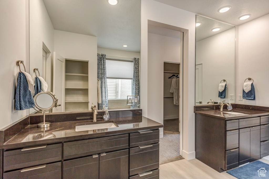 Bathroom with vanity and wood-type flooring