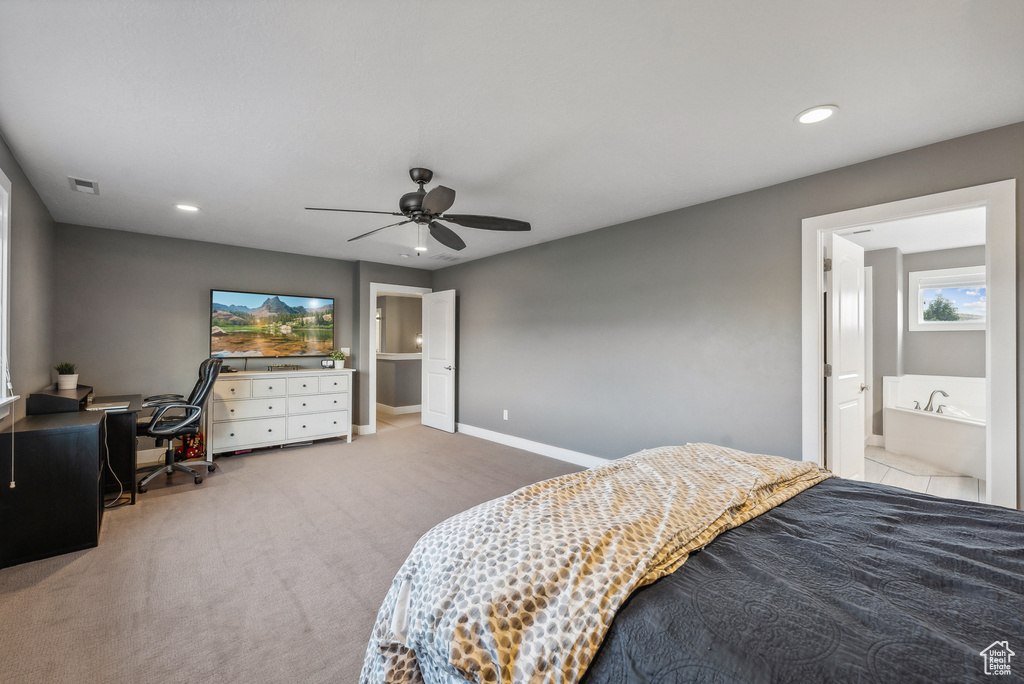 Bedroom featuring carpet, ceiling fan, and ensuite bath