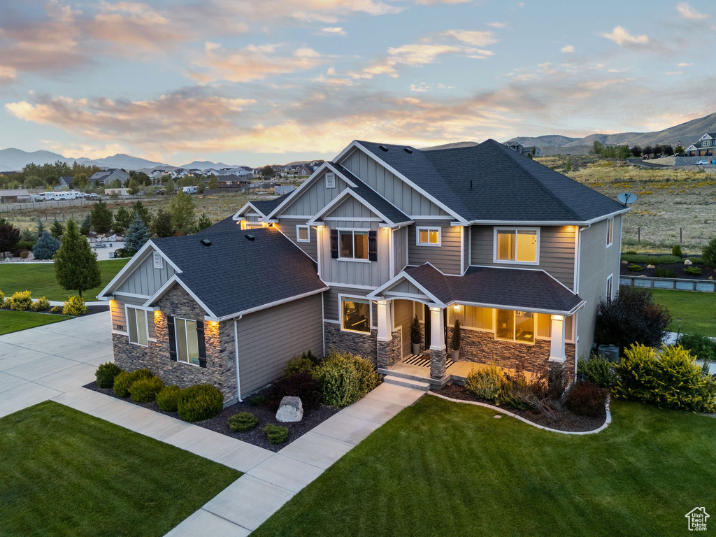 Craftsman house with a yard and a mountain view