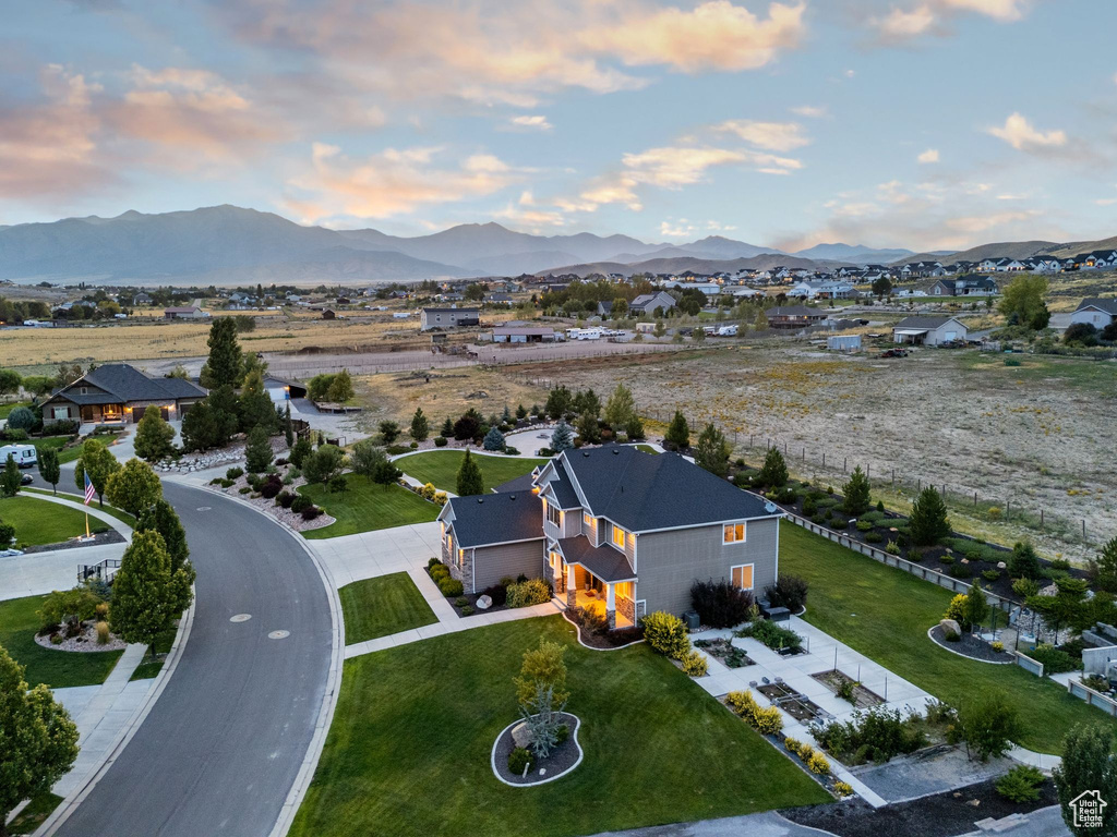 Aerial view at dusk featuring a mountain view