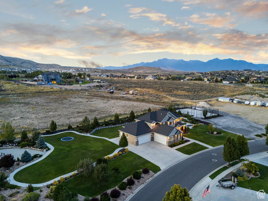 Aerial view at dusk featuring a mountain view