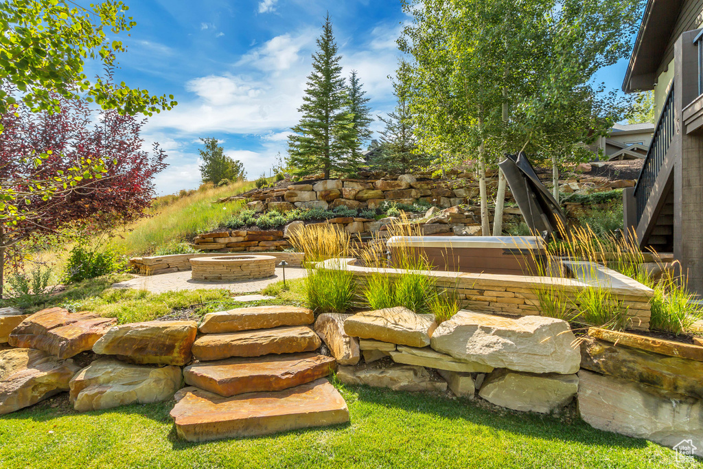 View of yard with an outdoor fire pit