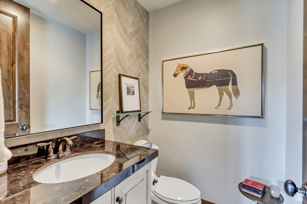 Bathroom featuring vanity and toilet