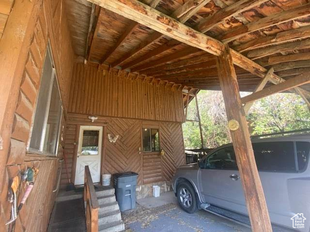 View of parking with a carport