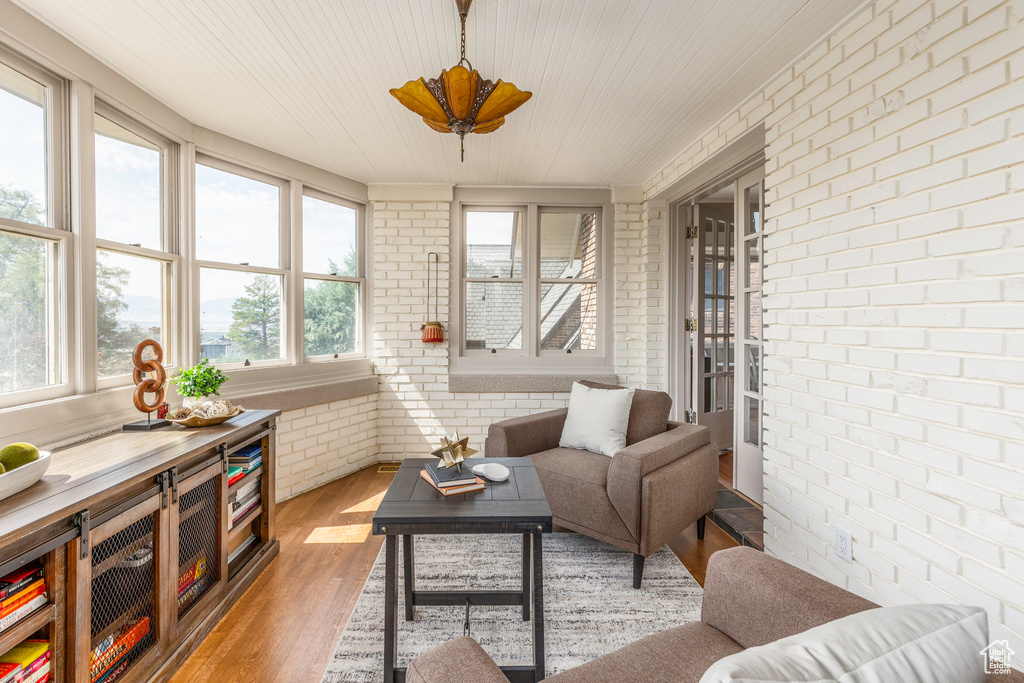 Sunroom with ceiling fan and plenty of natural light