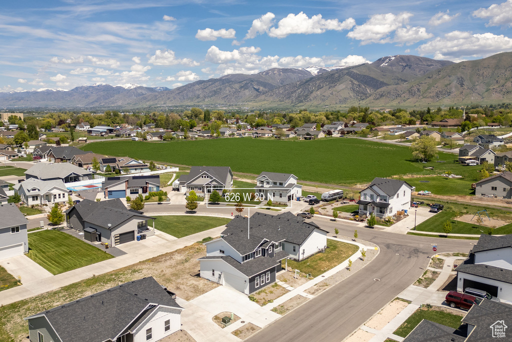 Aerial view of residential area with a mountainous background