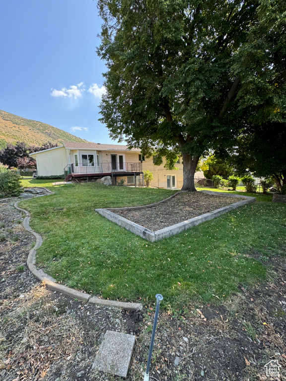 View of yard with a deck