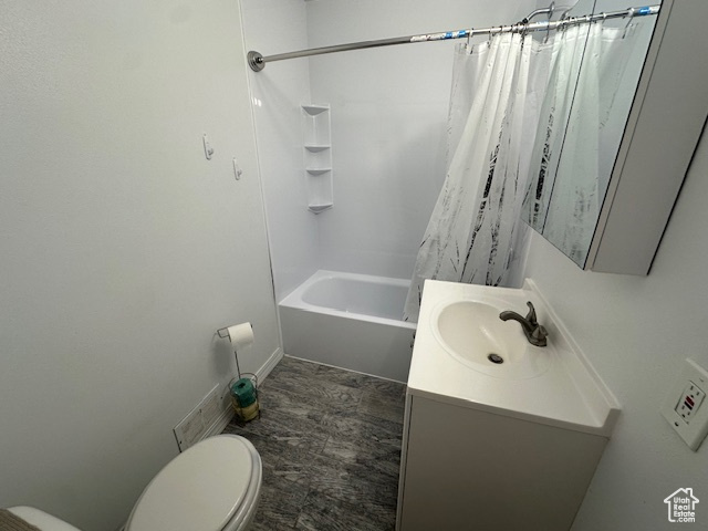 Full bathroom with vanity, toilet, and shower / tub combo