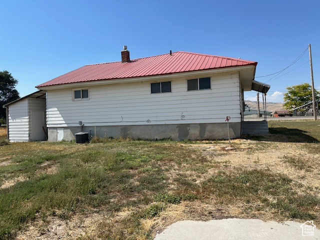 Back of property with central AC unit