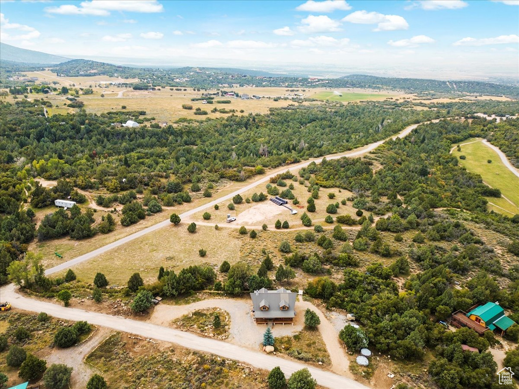 Birds eye view of property with a rural view