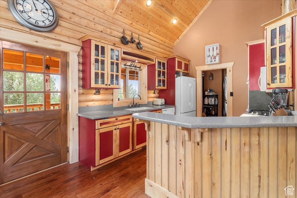 Kitchen featuring wooden ceiling, white refrigerator, dark hardwood / wood-style flooring, and a wealth of natural light