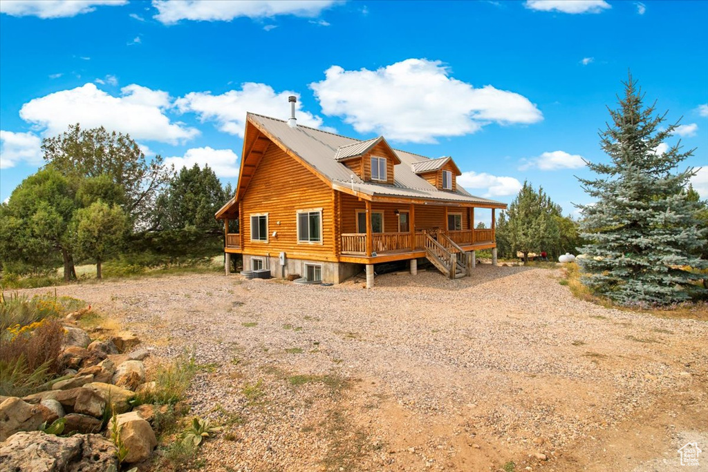 Rear view of property featuring a deck