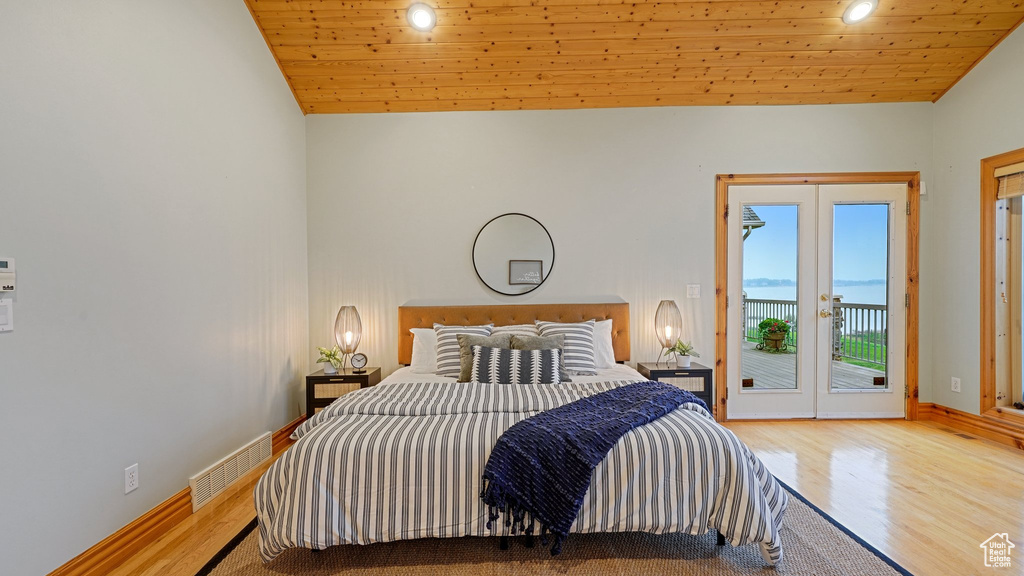 Bedroom with access to exterior, wooden ceiling, french doors, lofted ceiling, and light hardwood / wood-style floors