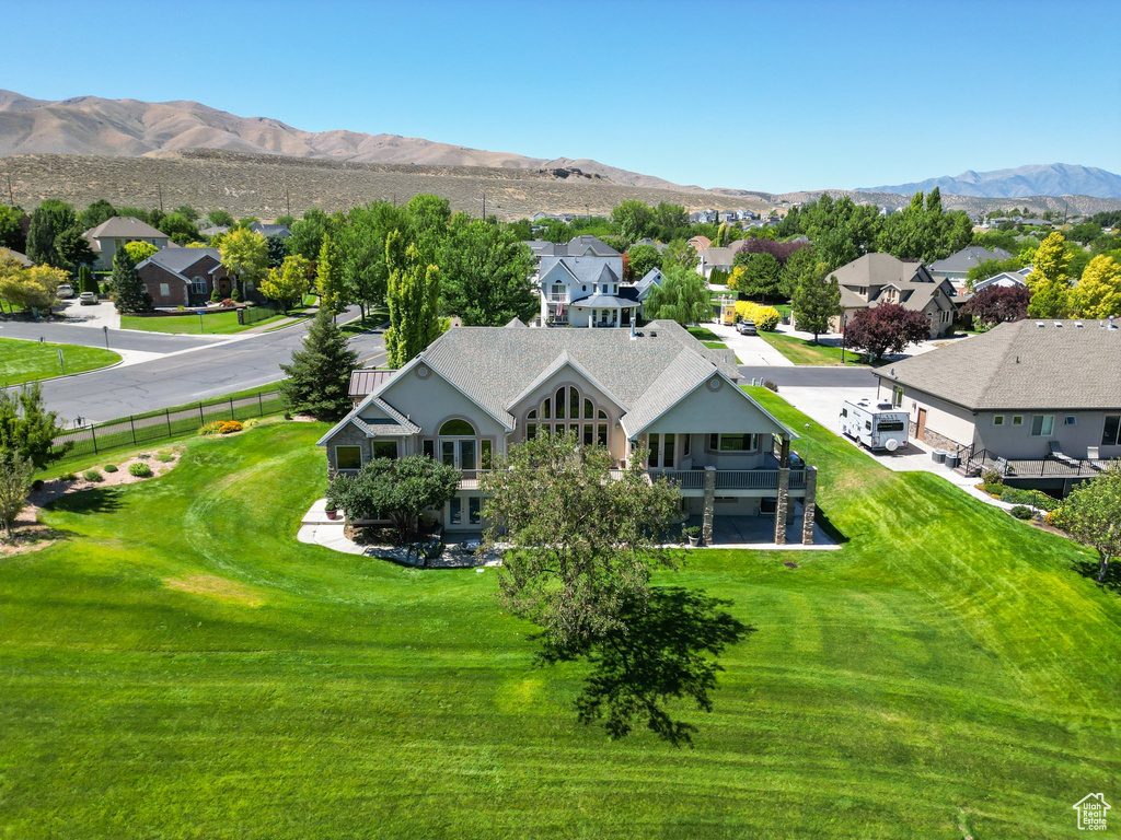 Birds eye view of property with a mountain view