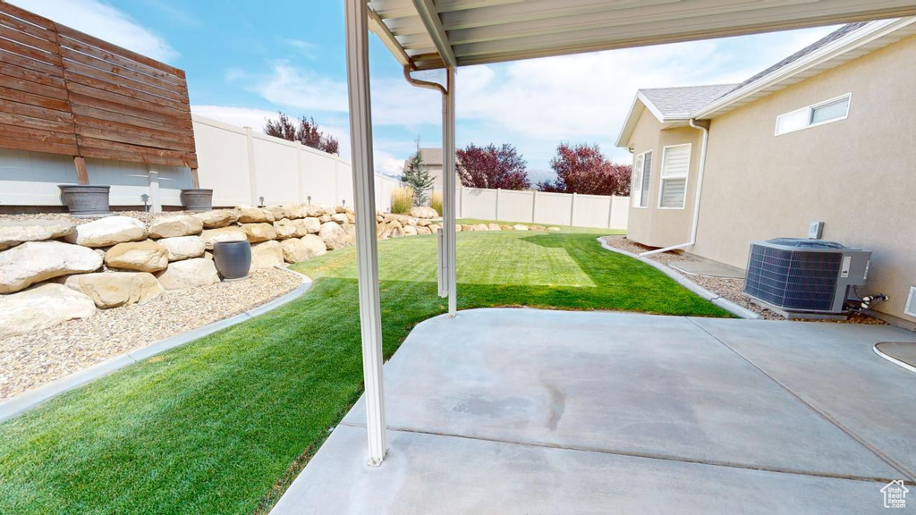 View of yard featuring a patio area and central AC