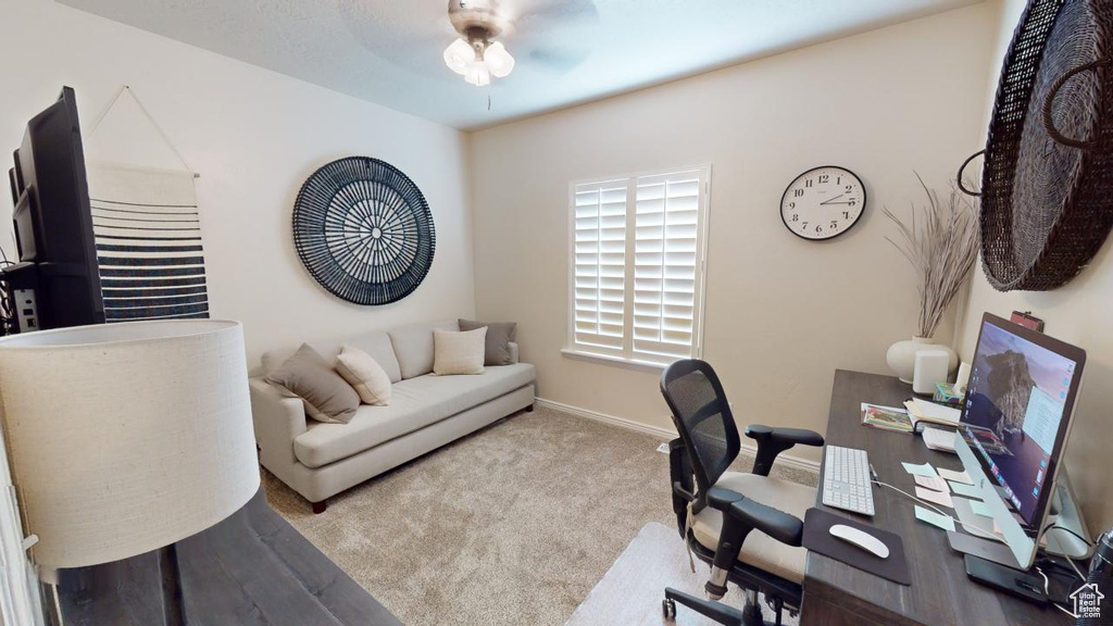 Office featuring light colored carpet and ceiling fan