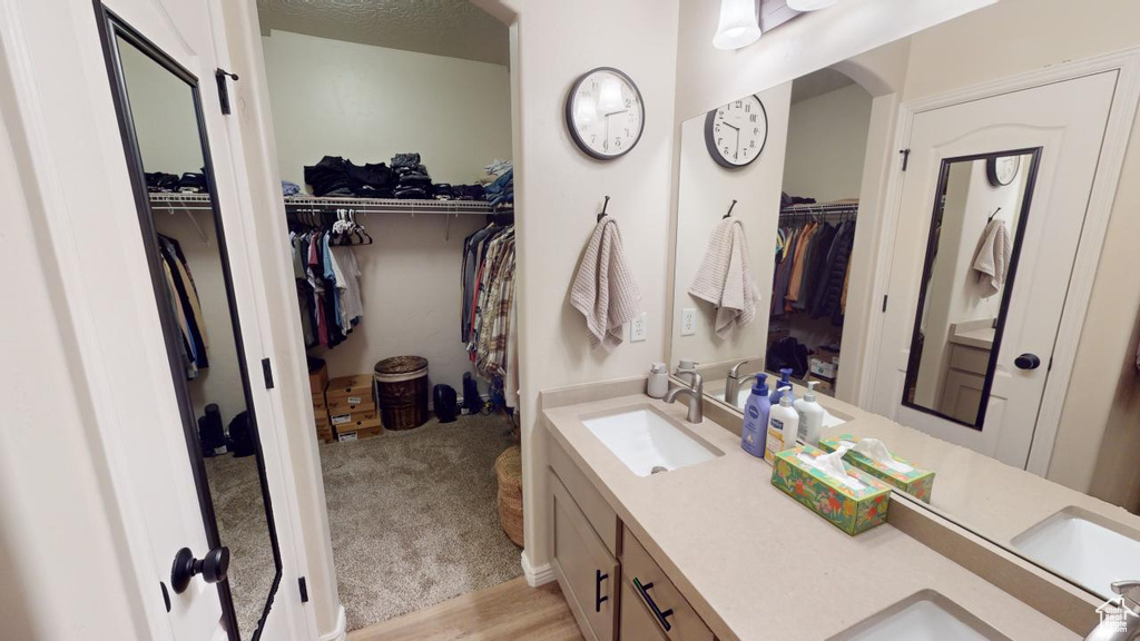 Bathroom featuring vanity and hardwood / wood-style flooring